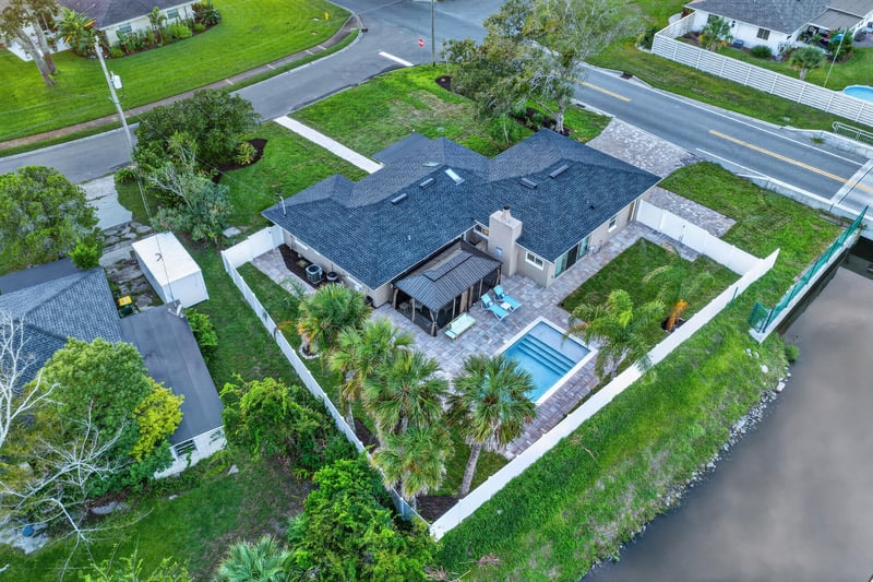 Aerial view of backyard pool and patio at 1525 8th St N, Jacksonville Beach, FL