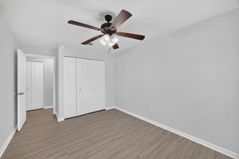 Hallway with closet doors and carpet at 3801 Crown Point Rd unit 2061, Jacksonville, FL 32257