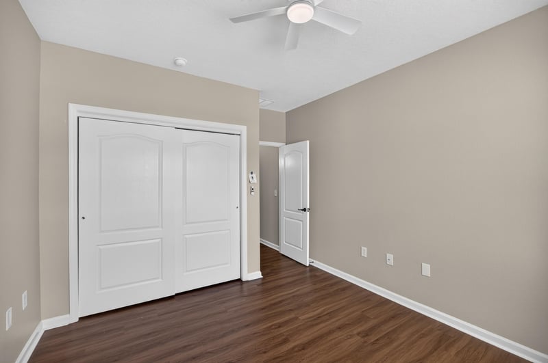 Bedroom with closet doors at 3750 Silver Bluff Blvd, Orange Park, FL