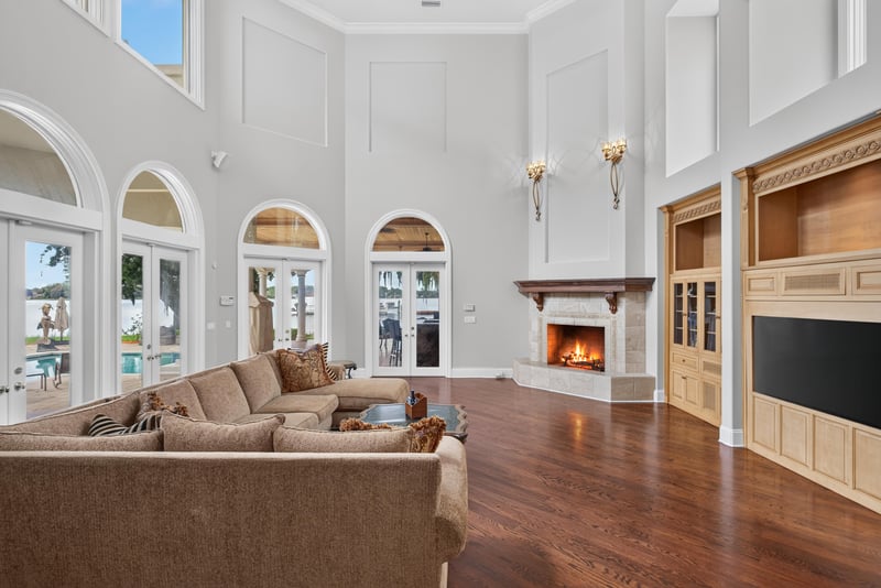 Family room with two-story windows and water view at 344 Broward Rd, Jacksonville, FL