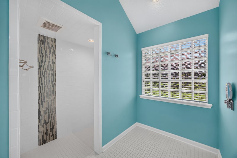 Primary bathroom shower and tile detail at 1955 GUARDED Way, Fleming Island, FL 32003