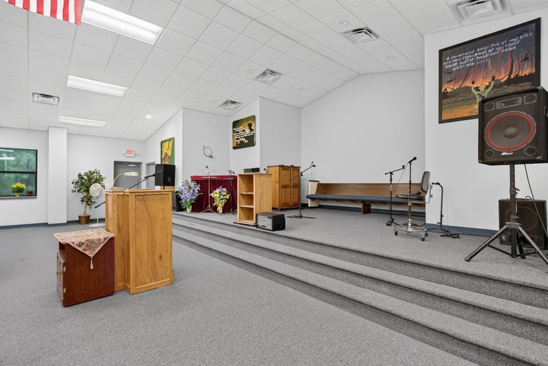 Stage area with podium, steps and wall art at 1038 County Rd 315, Melrose