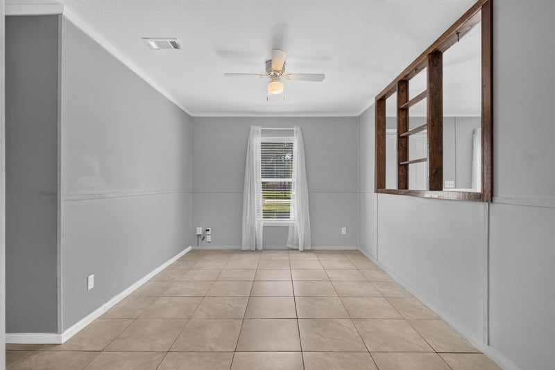 Second living area with wood-framed interior windows at 2549 Snapdragon Ave, Middleburg, FL 32068