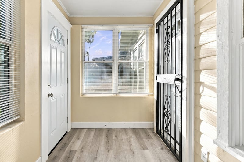Entry door with security bars, photographed by Megapixeler on W 24th St, Jacksonville