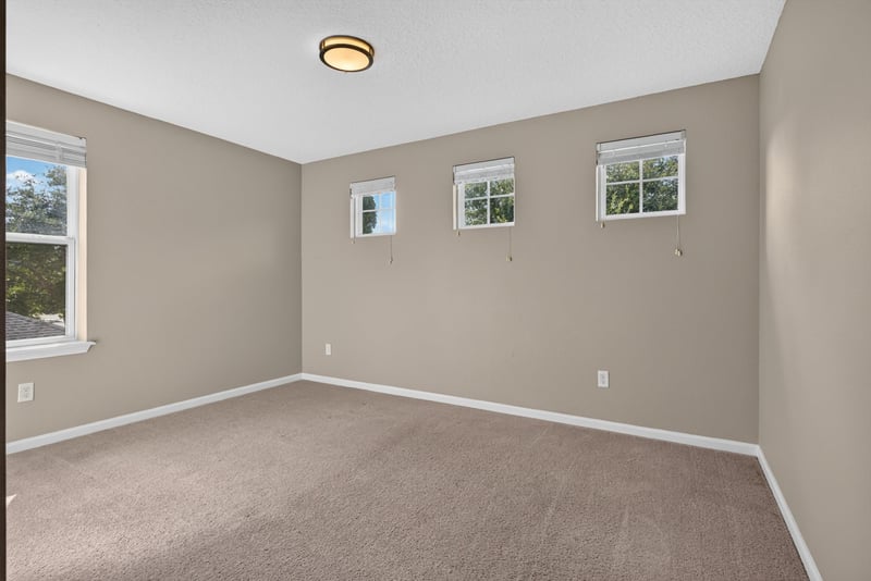 Bedroom with carpet and windows at 13685 Goodson Pl, Jacksonville, FL 32226