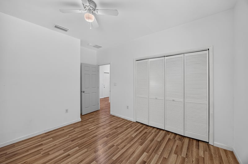 Bedroom with closet and ceiling fan at 1012 Fruit Cove Rd, Jacksonville, FL 32259