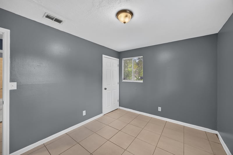 Hallway with doors and tile flooring at 6745 Jack Horner Ln, Jacksonville, FL 32210