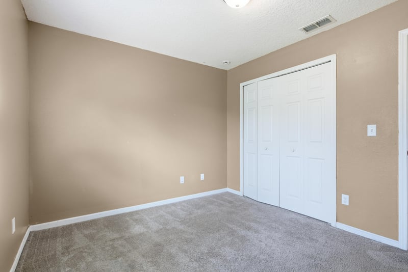 Empty bedroom with closet at 7392 Timber Falls Ct