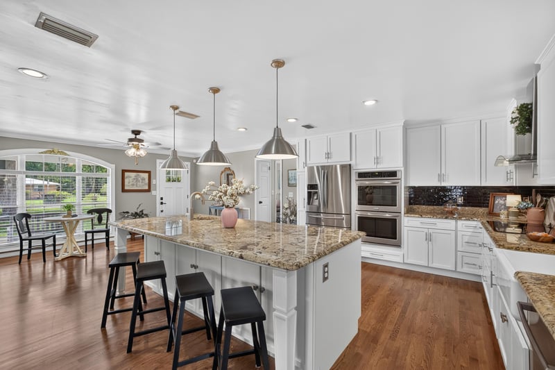 Kitchen with granite counters and double wall oven at 5843 Ovella Rd, Jacksonville, FL 32244