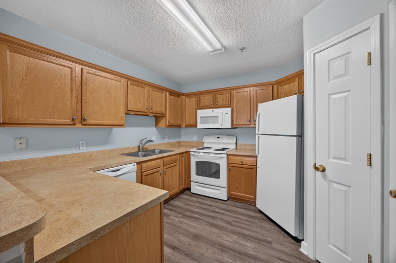 Kitchen with range and refrigerator at 1701 The Greens Way 1415, Jacksonville Beach, FL 32250