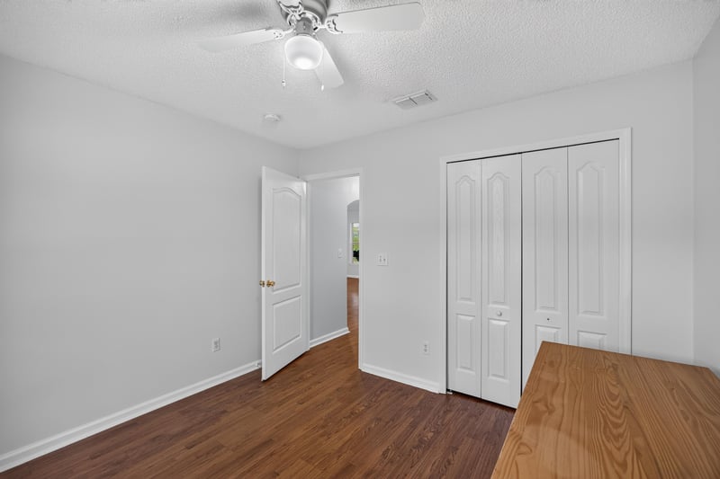 Bedroom with double closet doors at 9691 Nelson Forks Dr, Jacksonville, FL 32222