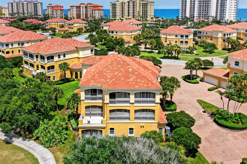 Aerial close-up of the home beside the golf course at 140 Ave De La Mer, Palm Coast, FL 32137