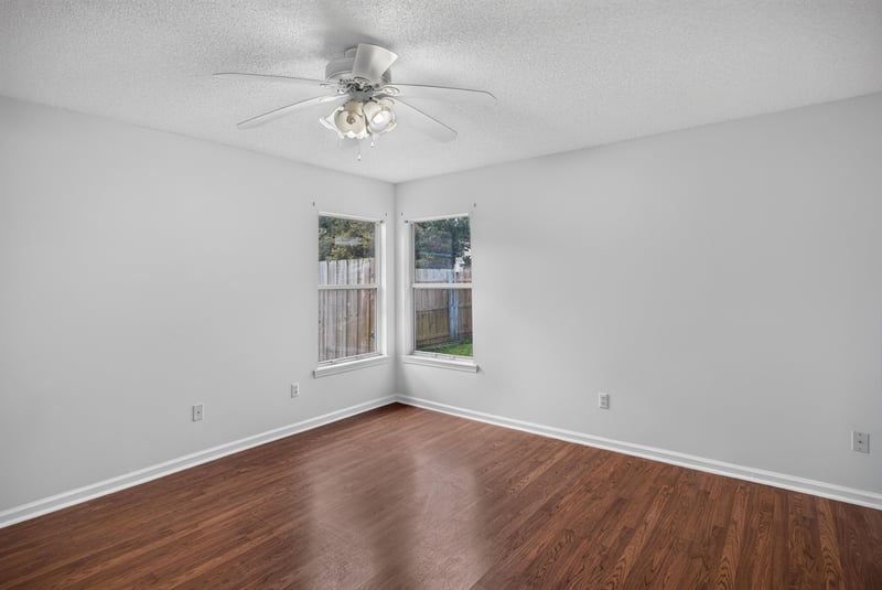 Bedroom with wood floors and window at 9691 Nelson Forks Dr, Jacksonville, FL 32222