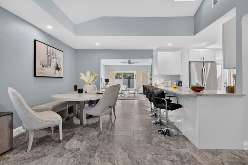 Dining area open to kitchen island at 1525 8th St N, Jacksonville Beach, FL
