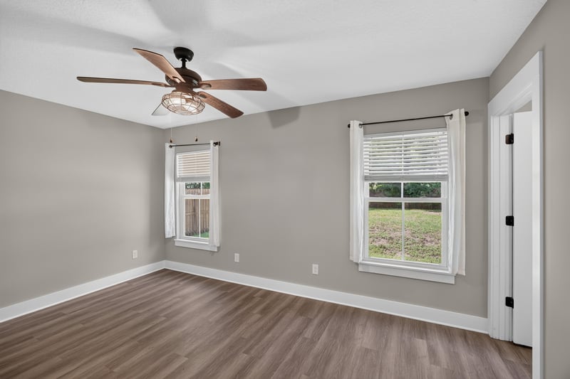 Empty bedroom with window and ceiling fan at 2855 N 8th St, St. Augustine, FL 32084