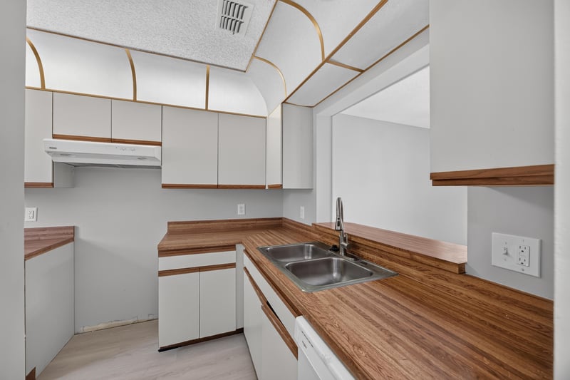 Kitchen with vaulted wood-trimmed ceiling and sink at 3801 Crown Point Rd, Jacksonville, FL 32257