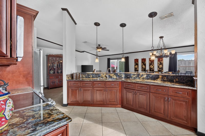 Kitchen counter with granite and cabinets at 6931 Cane Grass Ln E, Jacksonville, FL 32244