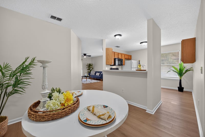 Dining area open to kitchen at 605 N Covered Bridge Rd, Jacksonville, FL