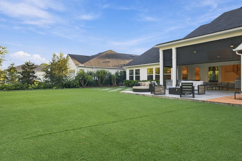 Backyard lawn and covered patio at 907 Seagrove Dr, Ponte Vedra Beach, FL 32081
