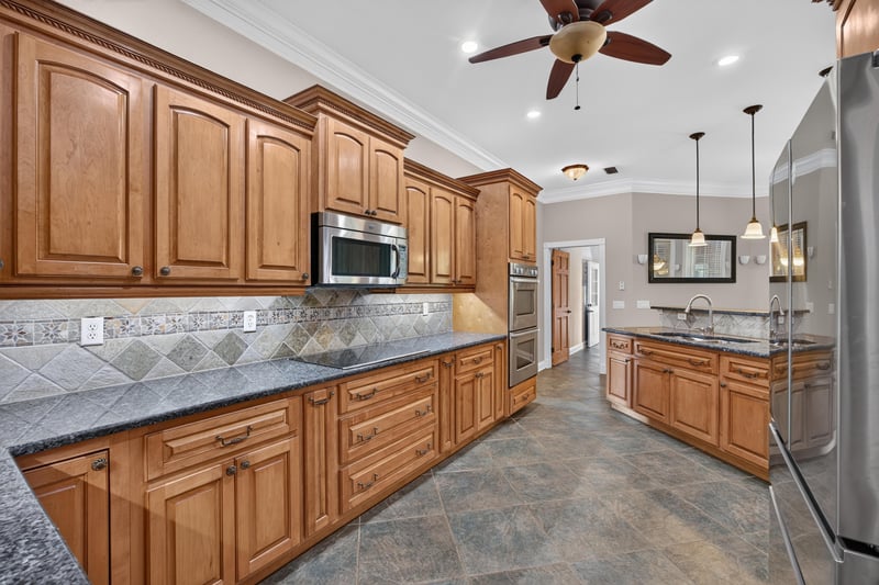 Kitchen with wood cabinets and granite counters at 1735 Hagans Ridge Ct