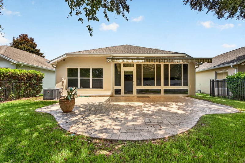 Rear exterior with screened porch at 11225 Water Spring Cir, Jacksonville, FL 32256