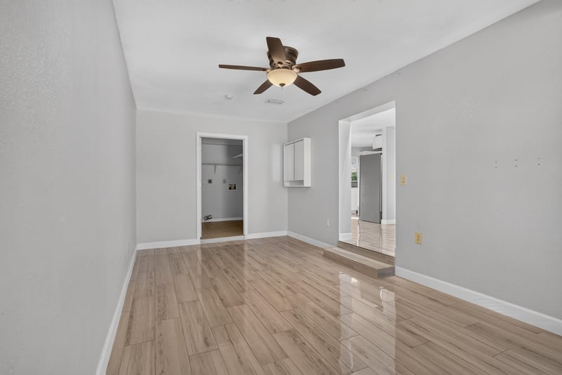 Living area with wood-look flooring and interior doors at 442 Ameca Ave, Orange Park, FL 32073