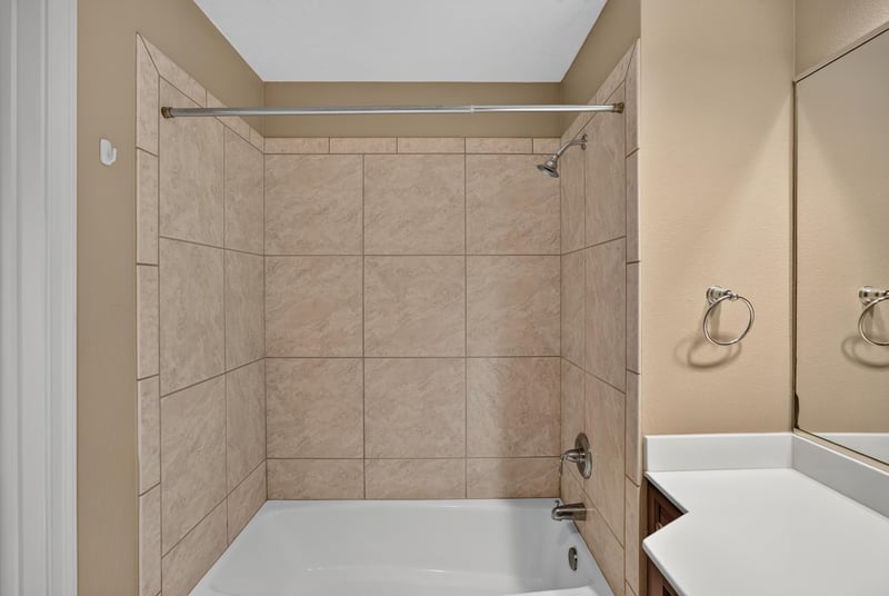 Bathroom shower with tile surround at 1478 Riverplace Blvd 1904, Jacksonville, FL 32207