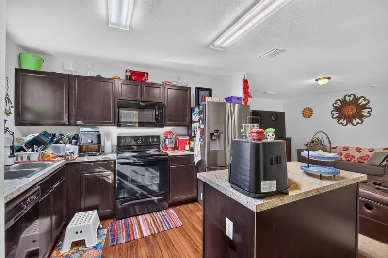 Kitchen view with microwave and stainless appliances at 518 Matecumbe Ct, Macclenny, FL
