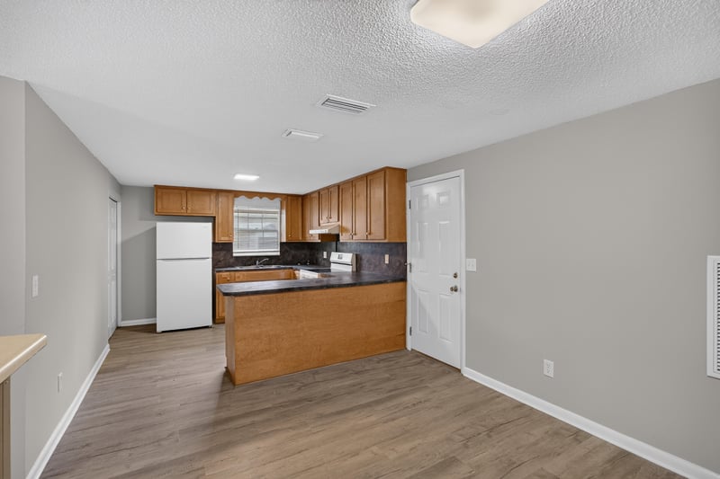 Kitchen with refrigerator and cabinet counter at 1435 Undine Ave, Jacksonville, FL