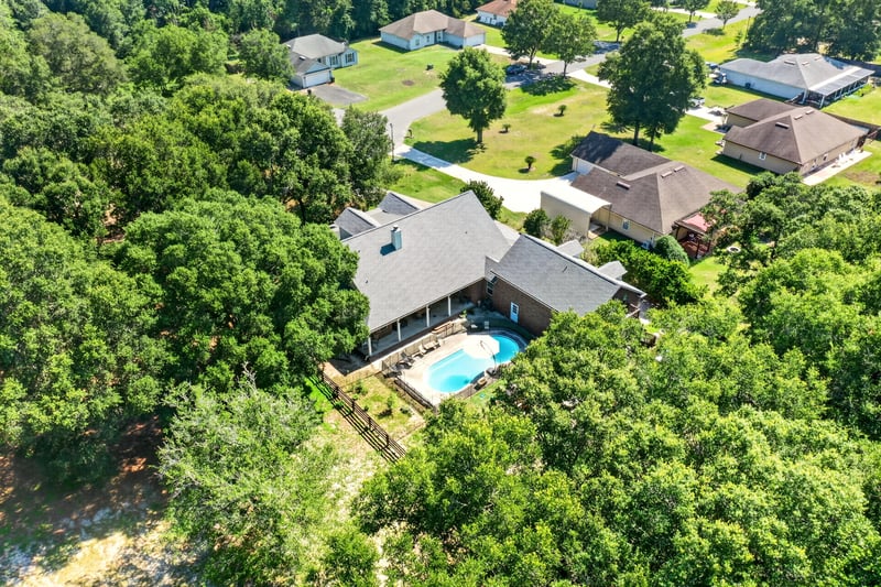 Aerial view of neighboring homes with pools in Green Cove Springs, FL