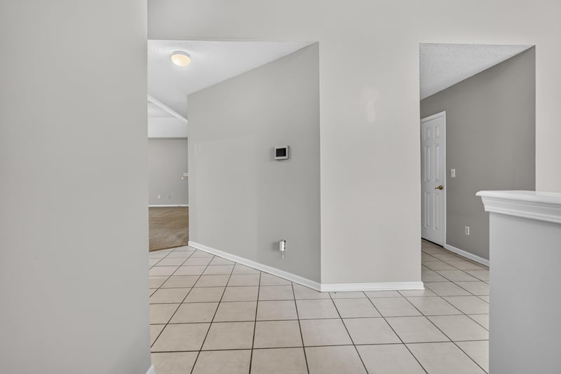 Tile entry hallway leading into the home at 11669 Collins Creek Dr, Jacksonville, FL 32258
