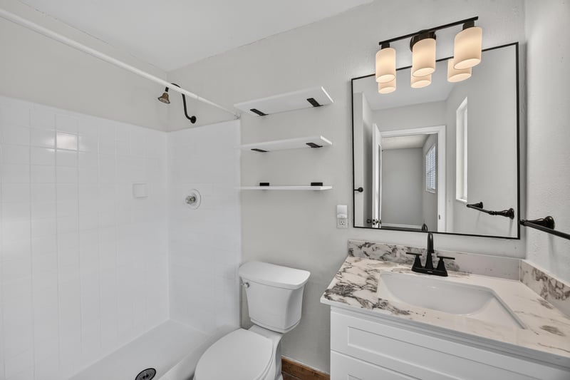 Bathroom with shower, vanity and shelving at 4039 Habana Ave, Jacksonville, FL