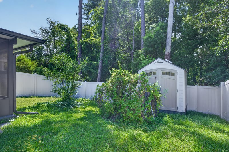 Backyard with storage shed and vinyl fence at 7118 Preston Pnes Trl, Jacksonville, FL