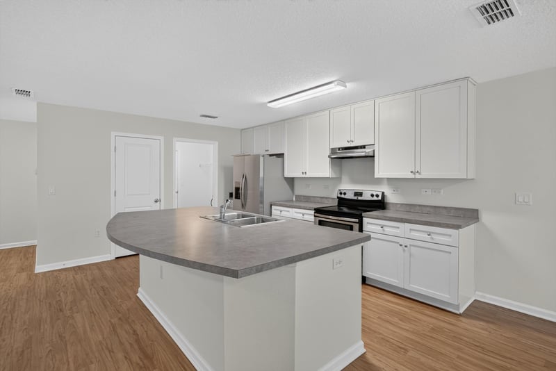 Kitchen island with stainless appliances at 95221 Siena Ct, Fernandina Beach, FL 32034