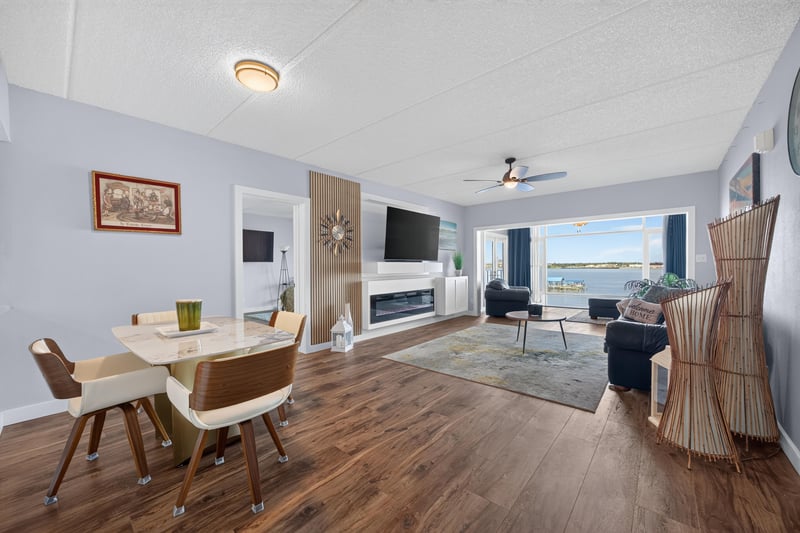 Dining and living area with fireplace and water view at 2280 Shepard St