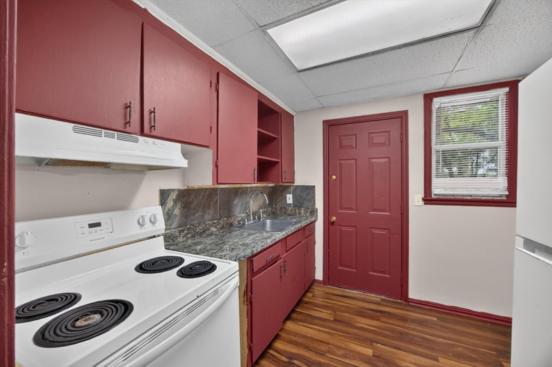 Kitchen with exterior door and range at 2132 Allandale Cir W, Jacksonville, FL