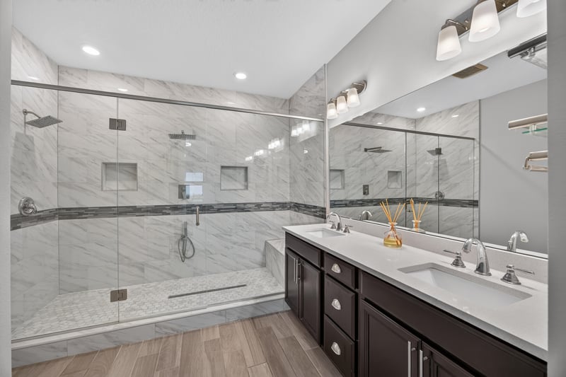 Primary bathroom with walk-in glass shower and double vanity at 91 Tilloo Ct, St. Johns, FL