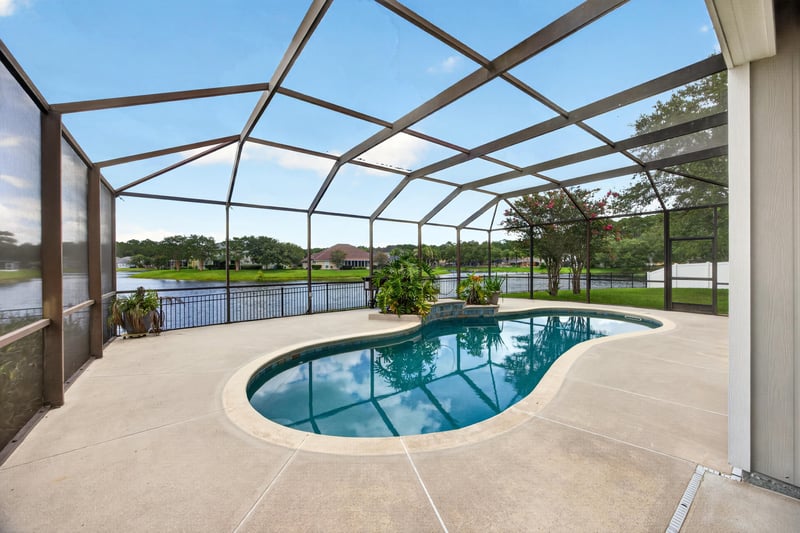 Screened pool with lake view at 1493 Greyfield Dr, St. Augustine, FL 32092