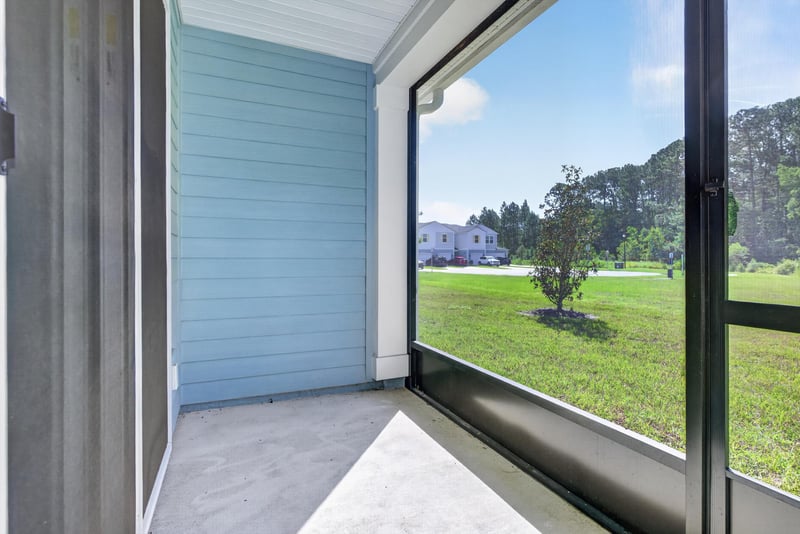 Screened porch with yard view at 39 Mellowood Ln, St. Augustine, FL 32092