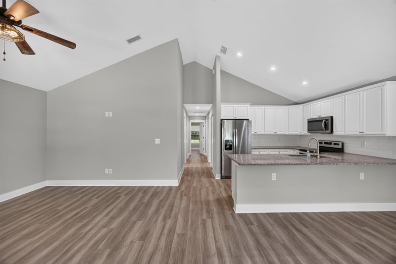 Entry hallway opening to kitchen with wood flooring at 2855 N 8th St, St. Augustine, FL 32084