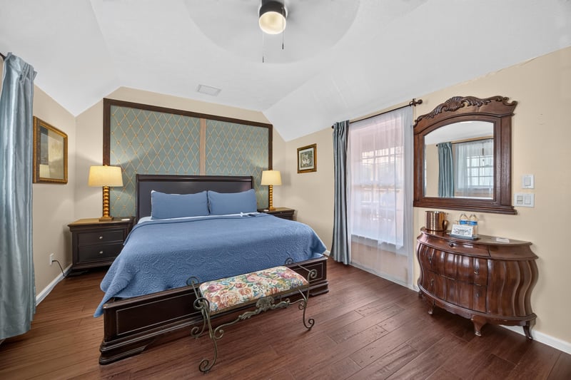Bedroom with a wood dresser and mirror at 115 Cordova St, St. Augustine, FL