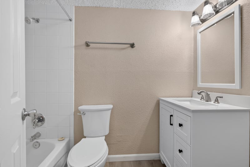 Bathroom with toilet and mirror at 5811 Atlantic Blvd unit 47, Jacksonville, FL 32207