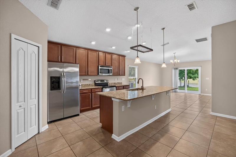 Kitchen with stainless appliances and island at 469 Glendale Ln, Orange Park, FL