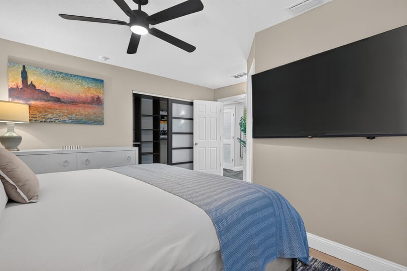Bedroom with ceiling fan and artwork at 1525 8th St N, Jacksonville Beach, FL