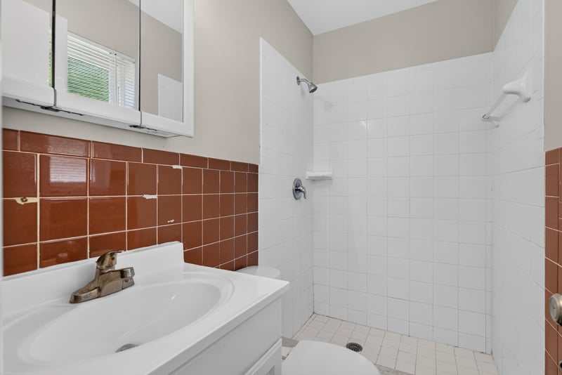 Bathroom with tile tub-shower and vanity at 5503 Boeing Dr, Jacksonville, FL 32207