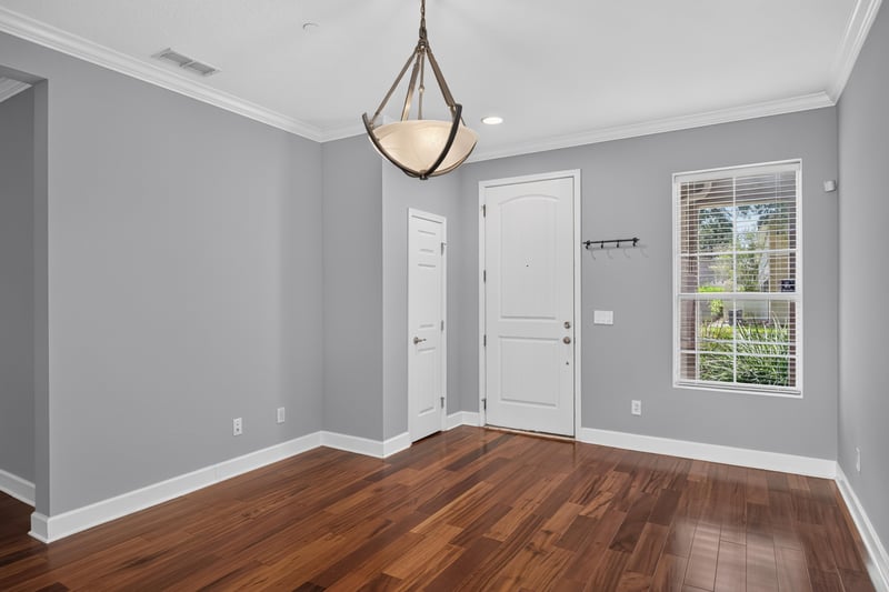 Foyer with front door and wood flooring at 6217 Eclipse Cir, Jacksonville, FL 32258