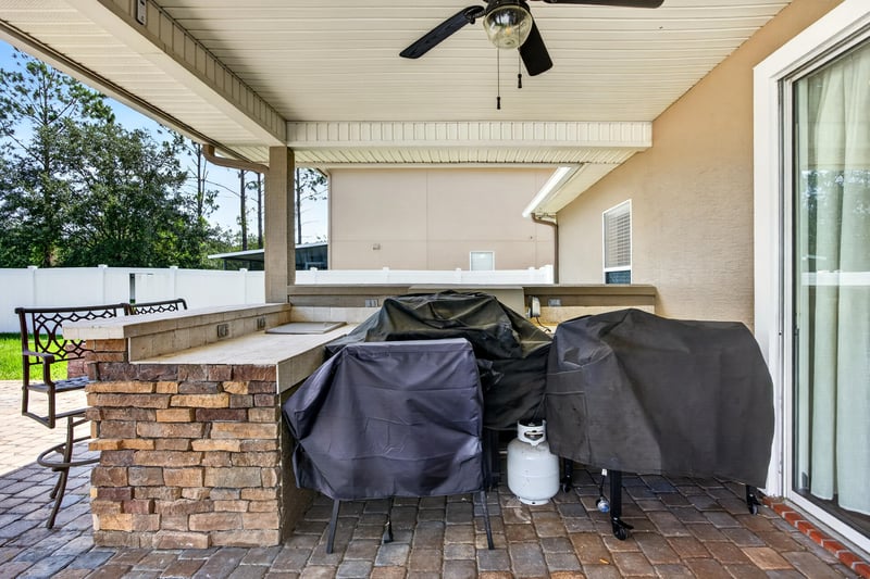 Covered patio with outdoor kitchen counter at 3660 Middlebrook Dr, Orange Park, FL 32065