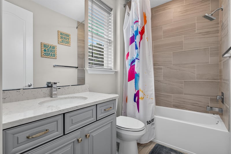 Bathroom with tub and shower combo at 22 Azura Point