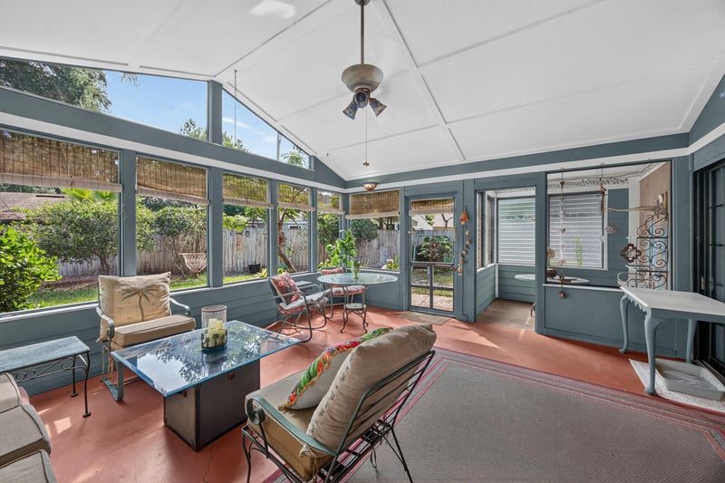 Screened sunroom with seating area at 4837 Pareja Ct, Jacksonville, FL 32225