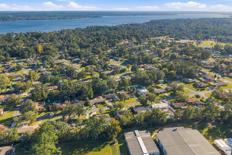 Drone aerial view of the neighborhood toward the lake, photographed by Megapixeler on Crosby Ln, Orange Park